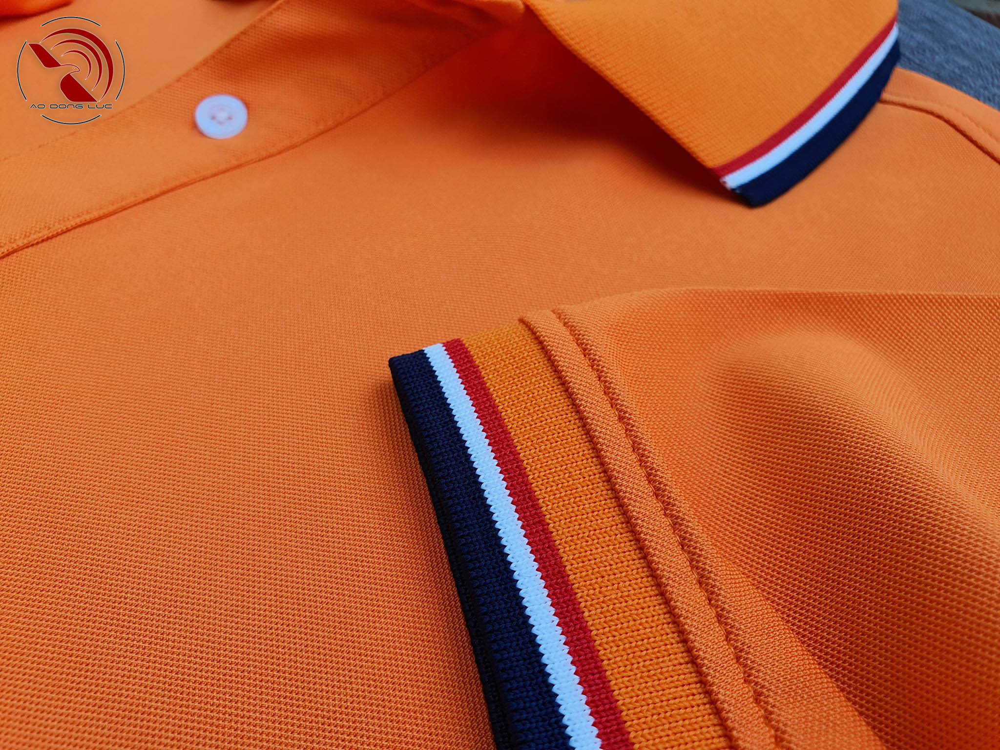 Chi tiết sản phẩm áo polo phối sọc cam - aodongluc