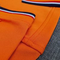 Chi tiết sản phẩm áo polo phối bo sọc màu cam