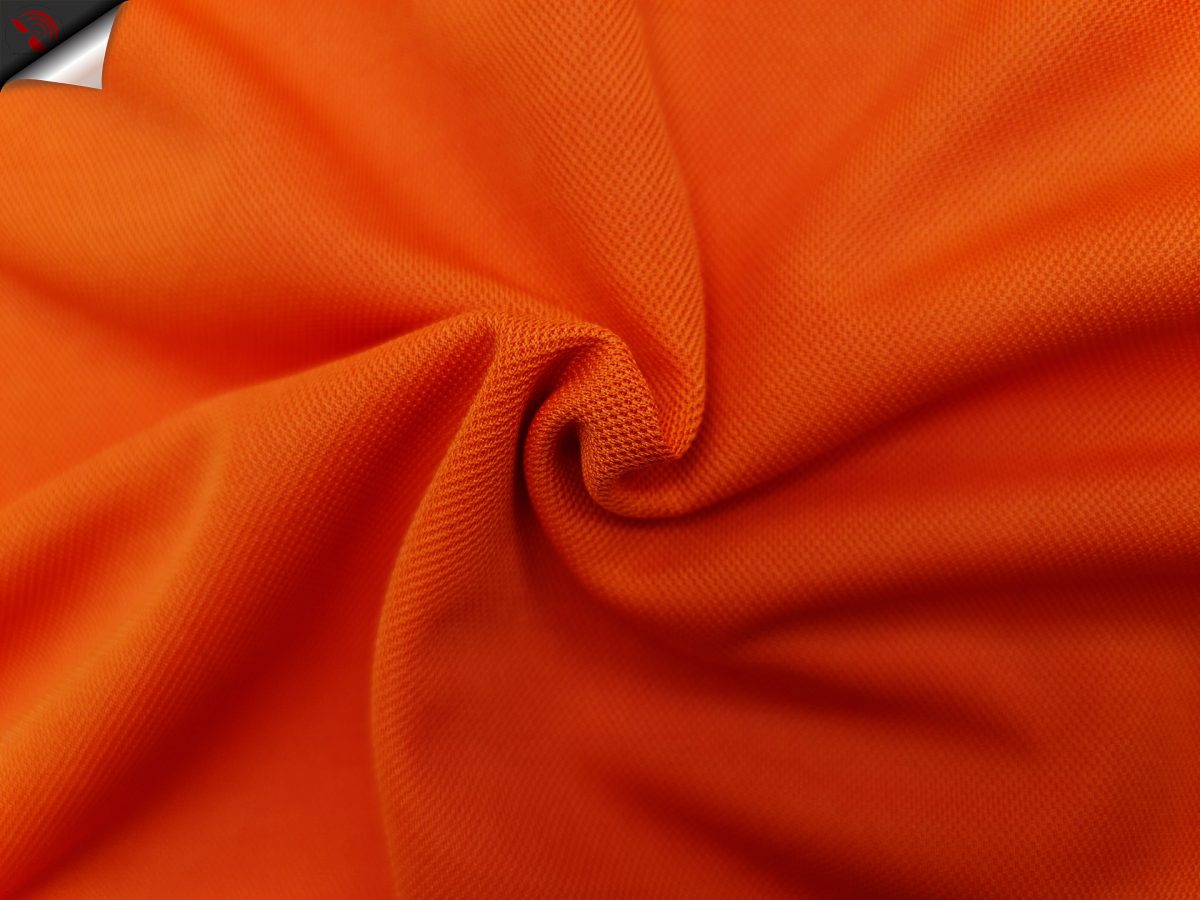 Hình chụp cận cảnh chất vải áo polo bo trơn cá sấu mè unisex màu cam