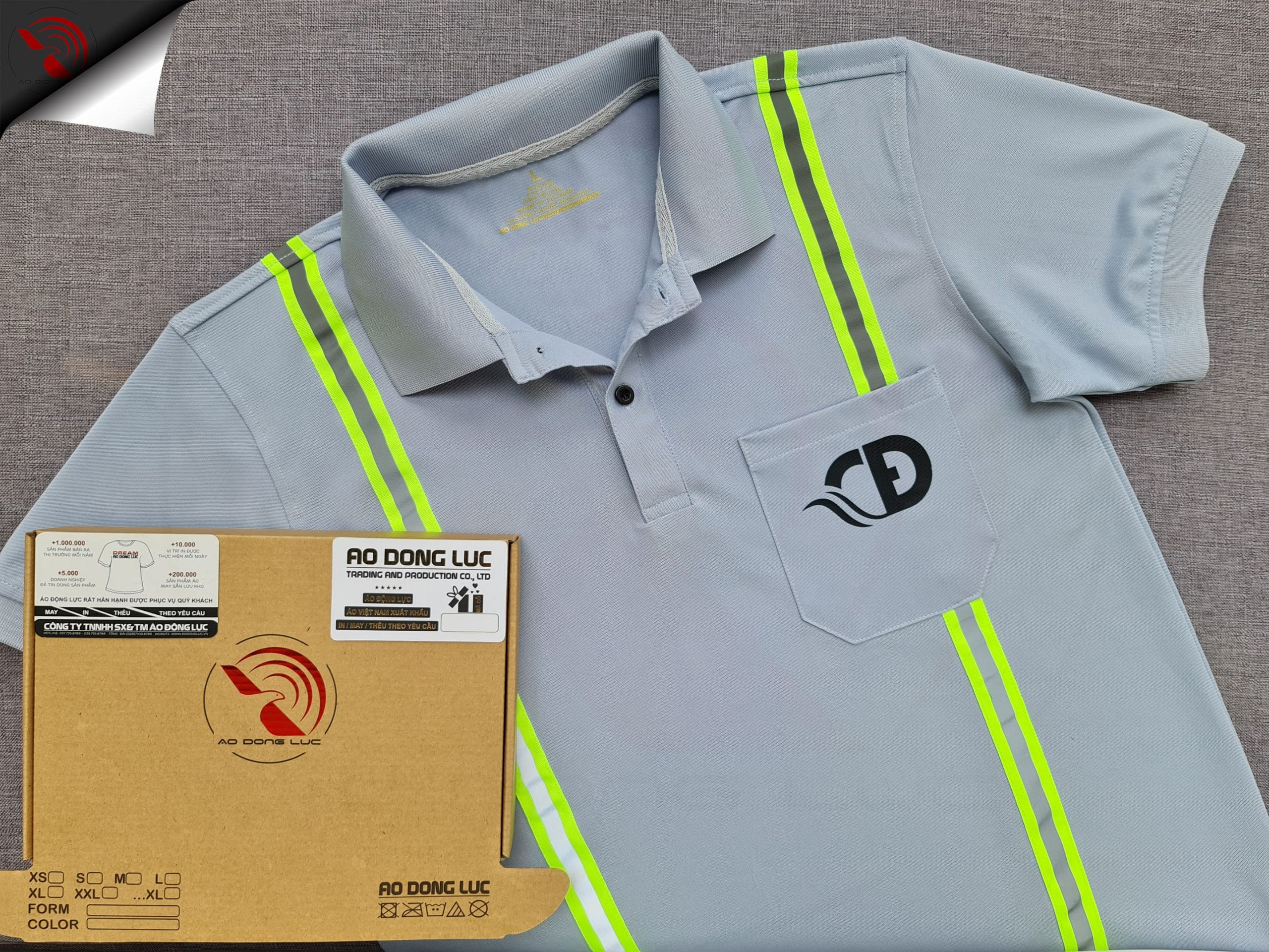 Đồng phục áo thun polo màu xám lam may phối dây quảng quang in kỹ thuật số