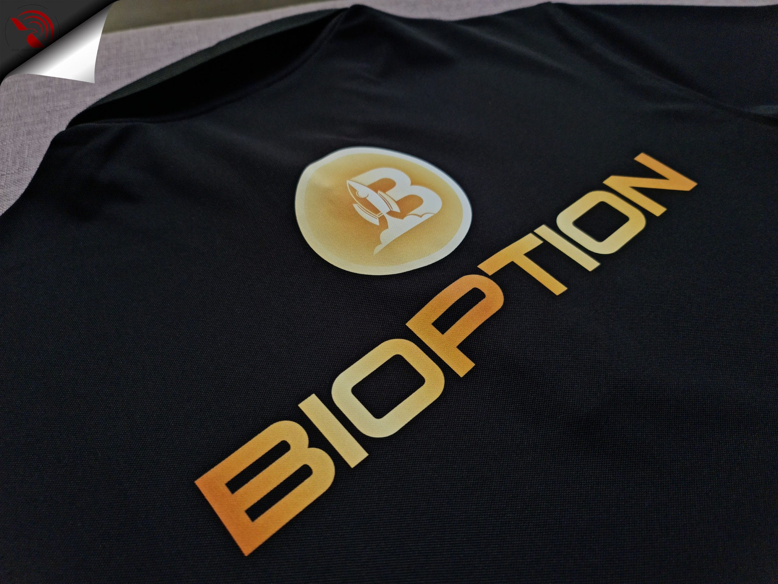 ao-polo-dong-phuc-mau-den-in-kts-3t-group-boption-lung Hình in kỹ thuật số lên áo thun đồng phục polo bo trơn màu đen