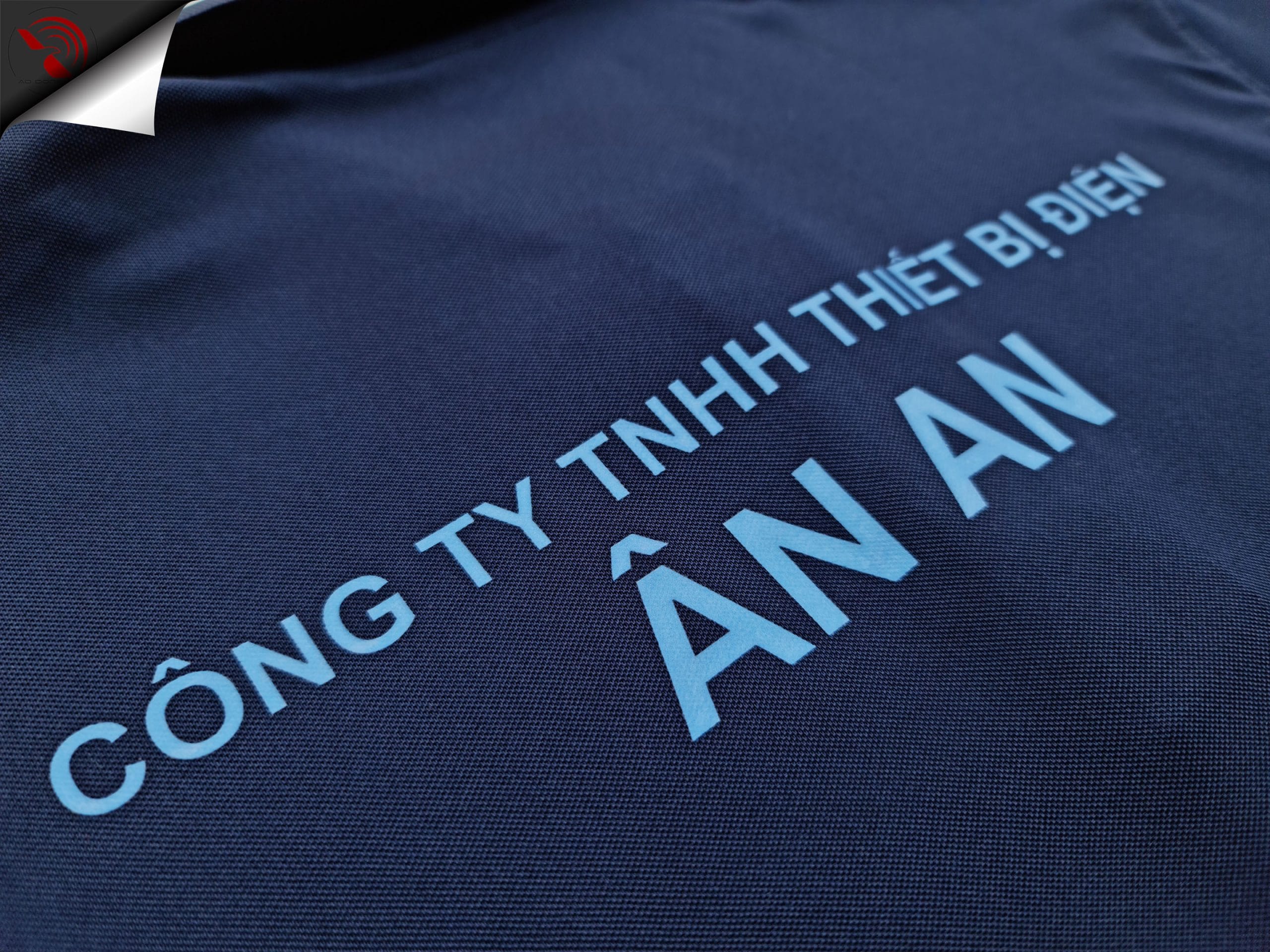 ao-polo-dong-phuc-xanh-den-in-kts-thiet-bi-dien-an-an-lung Hình in kỹ thuật số lên áo thun đồng phục polo bo trơn xanh đen