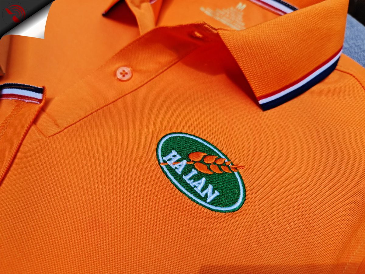 Hình thêu vi tính logo lên áo thun đồng phục polo bo sọc màu cam